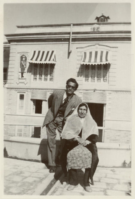 With his maternal grandmother, circa 1330s (1950s).